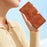 For iPhone 16 Plus Case Leather Imprinted Flower Card Slots Pocket Phone Cover with Wrist Strap - Brown - 7