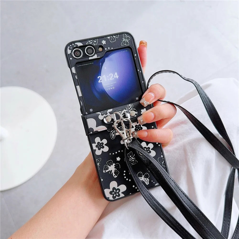For Samsung Galaxy Z Flip7 FE 5G / Z Flip6 5G Butterfly and Flower Pattern PU Leather Coated PC Phone Cover with Crossbody Strap - Black - 1