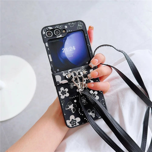 For Samsung Galaxy Z Flip7 FE 5G / Z Flip6 5G Butterfly and Flower Pattern PU Leather Coated PC Phone Cover with Crossbody Strap - Black - 1