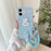 For iPhone 16 Case Cute Pattern Soft PU+PC Phone Back Cover with Braided Handy Strap - Sky Blue Rabbit - 2