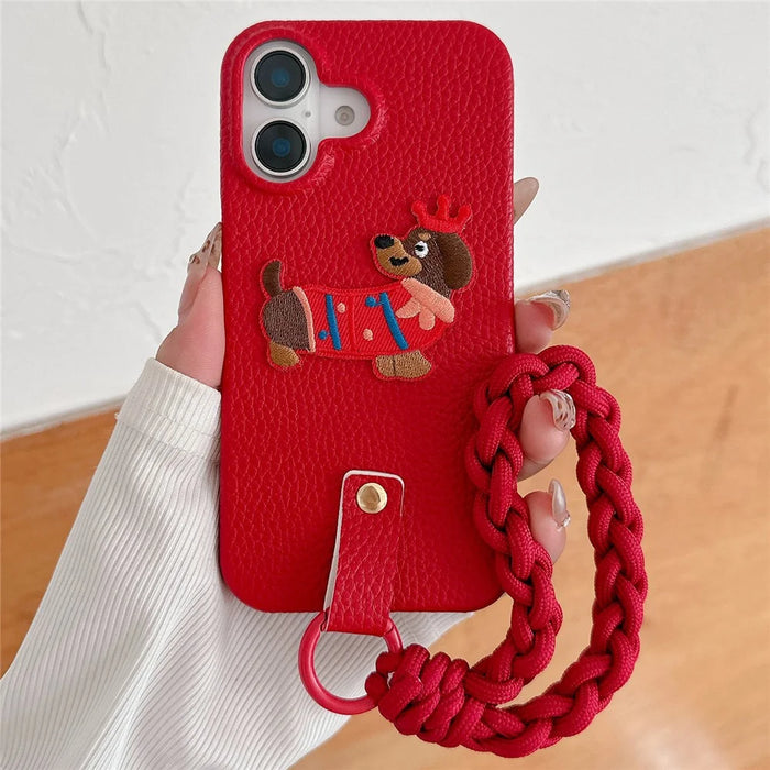 For iPhone 16 Case Christmas Design Cute Dog Pattern PU+PC Phone Back Cover with Braided Handy Strap - 1