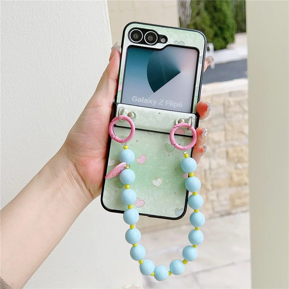For Samsung Galaxy Z Flip7 FE 5G / Z Flip6 5G Case Anti Drop PC + PU Phone Back Cover with Beaded Strap Pattern Design - Green Heart - 1
