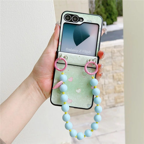 For Samsung Galaxy Z Flip7 FE 5G / Z Flip6 5G Case Anti Drop PC + PU Phone Back Cover with Beaded Strap Pattern Design - Green Heart - 1