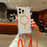 For iPhone 15 Pro Magnetic Case with Lanyard Drop-Proof TPU + PC Phone Back Cover - Orange - 1