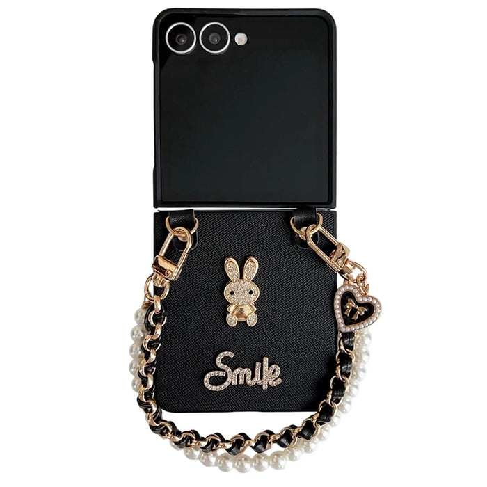 For Samsung Galaxy Z Flip7 5G Case Smile Rabbit PU + PC Phone Cover with Wrist Strap - Cross Texture - 1