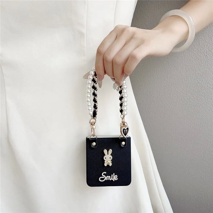 For Samsung Galaxy Z Flip7 5G Case Smile Rabbit PU + PC Phone Cover with Wrist Strap - Cross Texture - 3