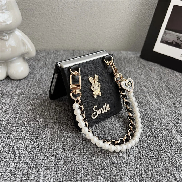 For Samsung Galaxy Z Flip7 5G Case Smile Rabbit PU + PC Phone Cover with Wrist Strap - Cross Texture - 4