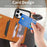 For iPhone 18 Pro / 17 Pro Case Line Imprinted Color Splicing Leather Phone Cover - Orange - 6