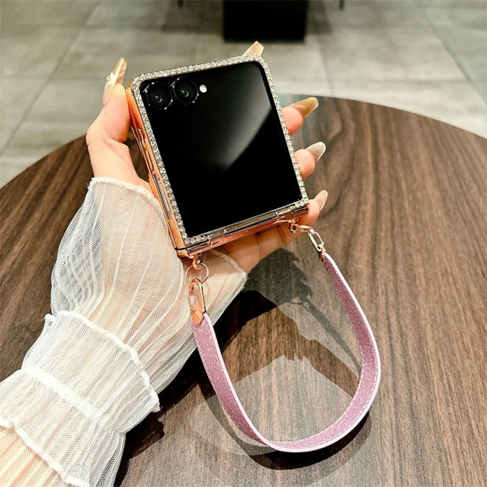 For Samsung Galaxy Z Flip7 5G Case Electroplated Edge Rhinestone Glitter PC Phone Cover with Hand Strap - Rose Gold - 5