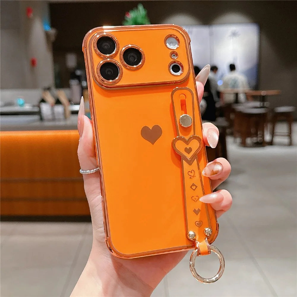 For iPhone 17 Pro Max Case Wristband Kickstand Electroplated Love Heart TPU Phone Cover Finger Holder - Orange - 1
