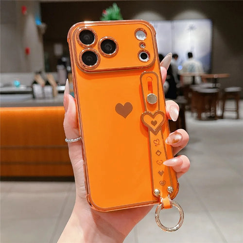 For iPhone 17 Pro Max Case Wristband Kickstand Electroplated Love Heart TPU Phone Cover Finger Holder - Orange - 1