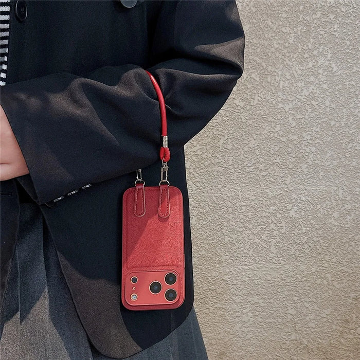 For iPhone 17 Pro Case TPU PU Leather PC Anti-drop Phone Back Cover with Wrist Strap - Red Leather Strip - 3