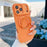 For iPhone 17 Pro Max Magnetic Case Rotating Ring Kickstand PC + TPU Skin-touch Phone Cover - Transparent Orange - 1