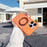 For iPhone 16 Pro Magnetic Case Rotating Ring Kickstand PC + TPU Skin-touch Phone Cover - Transparent Orange - 2