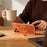 MUTURAL for iPhone 17 Pro Max Magnetic Case Rotating Kickstand PC + TPU Airbag Drop Protection Phone Cover - Orange - 3