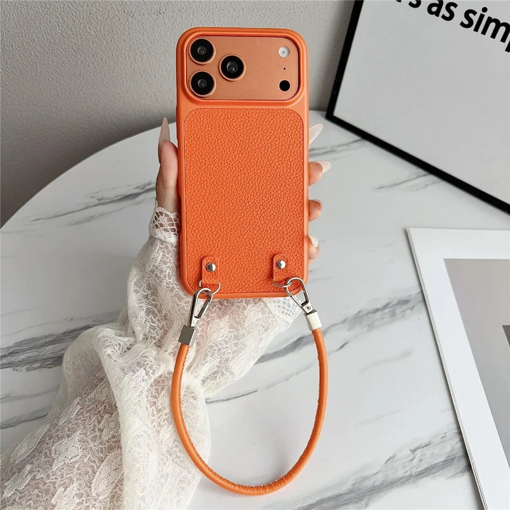 For iPhone 17 Pro Case Metal Paint Litchi Texture PU Leather Phone Back Cover with Wrist Strap - Orange - 1