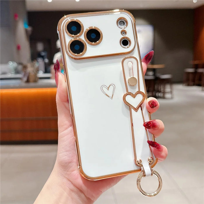 For iPhone 17 Pro Max Case Electroplated Heart Pattern TPU Phone Back Cover with Wristband Kickstand - Ivory White - 1