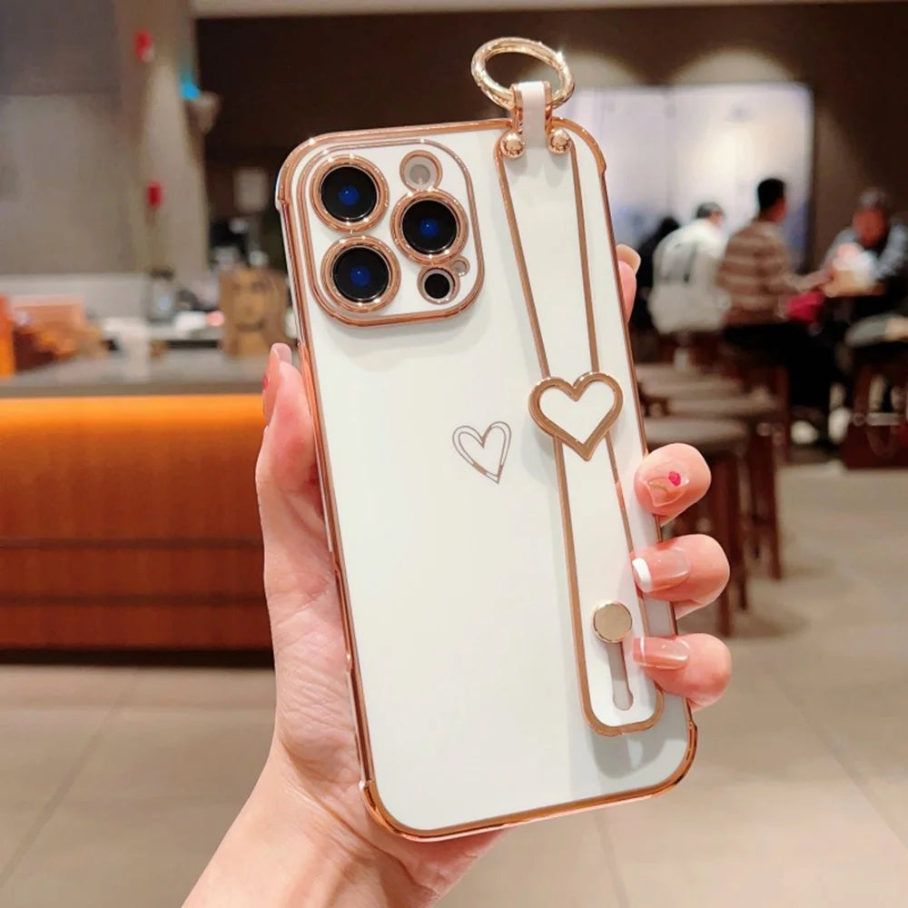 For iPhone 16 Pro Case Electroplated Heart Pattern TPU Phone Back Cover with Wristband Kickstand - Ivory White - 1