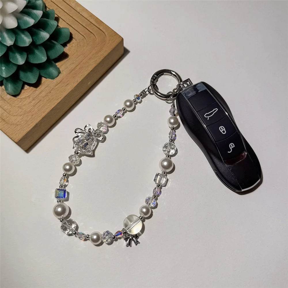 A1167 30cm Phone Charm Strap Zircon Bell Pearl Crystal Beaded Keychain Wrist Phone Lanyard with Removable Blank White Card - White - 2