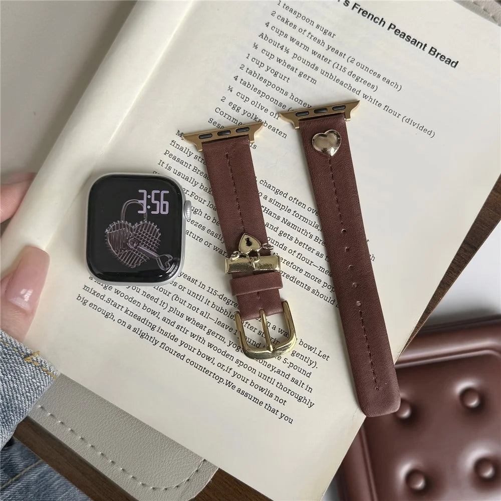 Wrist Strap for Apple Watch Ultra 3 2 1 49mm / Series 11 10 46mm / 9 8 7 45mm / SE3 SE2 SE 6 5 4 44mm / 3 2 1 42mm Heart Pendant Leather Watch Band - Coffee / Gold Buckle - 7