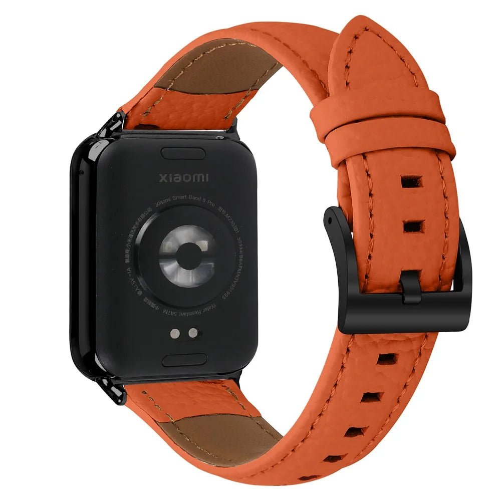Litchi Textured Genuine Leather Strap with Electroplated Buckle for Xiaomi Smart Band 10 Pro / 9 Pro / 8 Pro / Redmi Watch 6 / 5 / 4 Pointed-End Watch Band - Orange / Black - 1