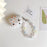 For Apple AirPods Pro Stylish Heart Pattern Bluetooth-compatible Earphone TPU Protective Cover Anti-drop Case with Flower Hand Strap - 4