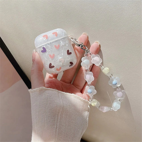 For Apple AirPods with Charging Case (2016)/(2019)/AirPods with Wireless Charging Case (2019) Lovely Heart Pattern Flower Wrist Strap Bluetooth-compatible Earphone Protective Cover TPU Case - 1