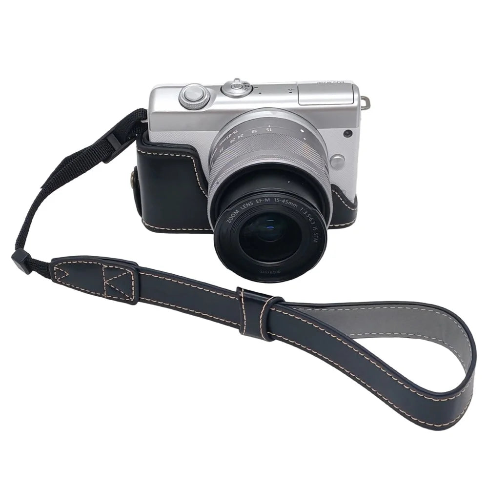 Camera Case for Canon EOS M10  /  M100  /  M200 Faux Leather Half Case with Hand Strap Removable Battery Access Base Cover - Black - 1