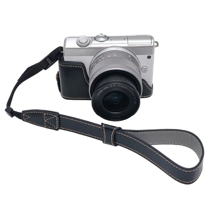 Camera Case for Canon EOS M10  /  M100  /  M200 Faux Leather Half Case with Hand Strap Removable Battery Access Base Cover - Black - 1