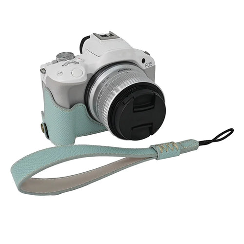 For Canon EOS R50 / R100 Anti-Shock PU Leather Camera Bottom Cover Large Opening Design Half Body Case with Strap - Baby Blue - 1