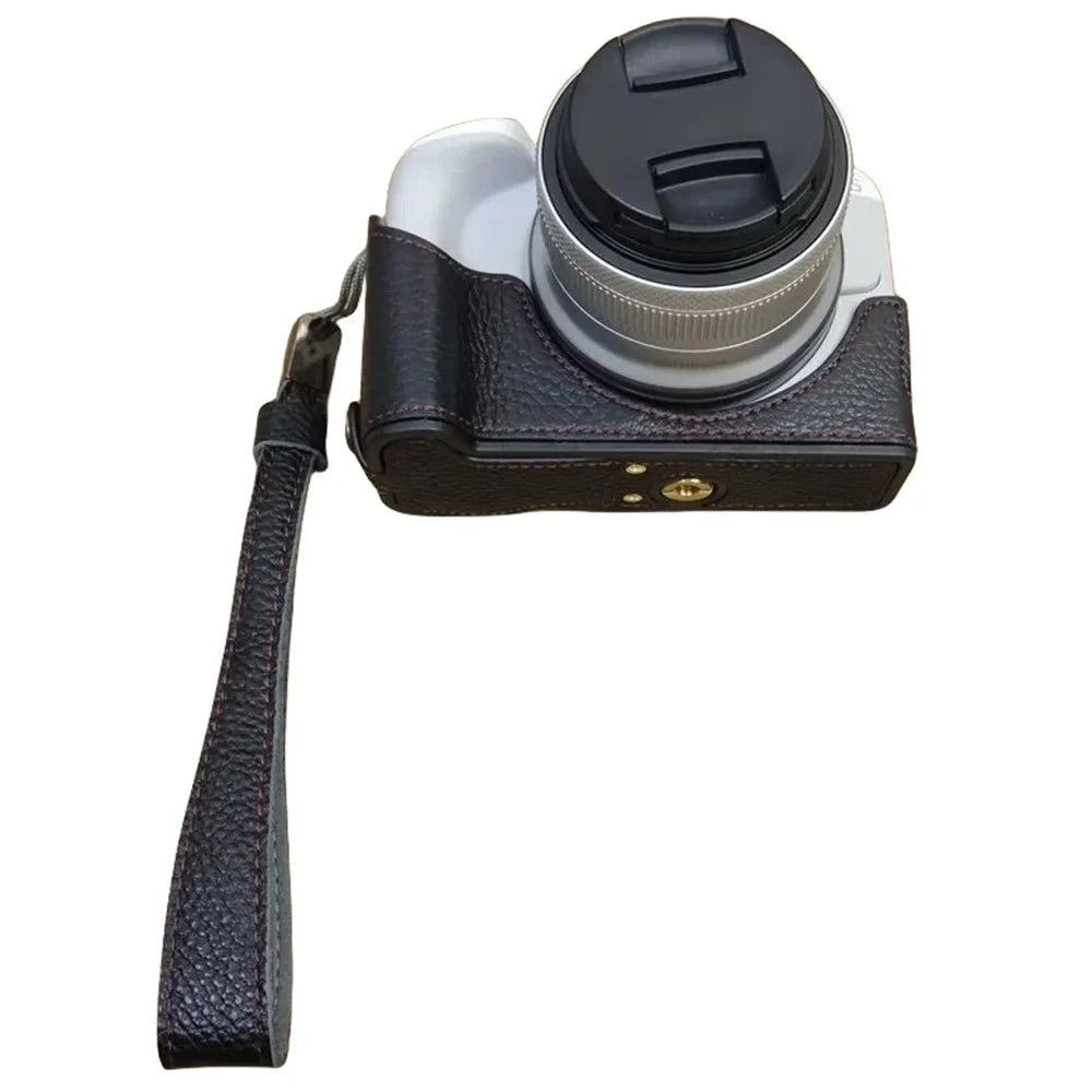 For Canon EOS R50 / R100 Genuine Cow Leather Camera Bottom Case Anti-drop Cover with Wrist Strap - Black - 1