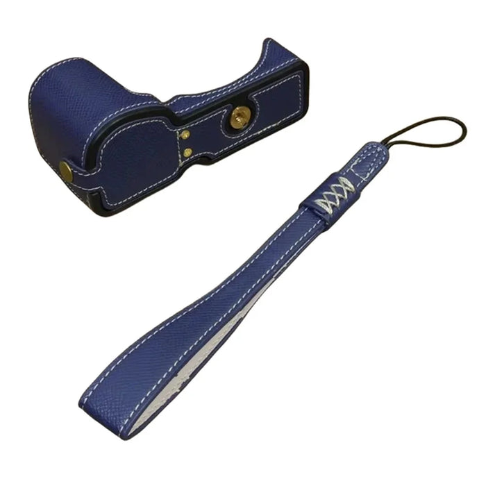 For Sony ZV-E10 PU Leather Bottom Case Battery Opening Design Camera Half Body Cover with Hand Strap - Sapphire - 1