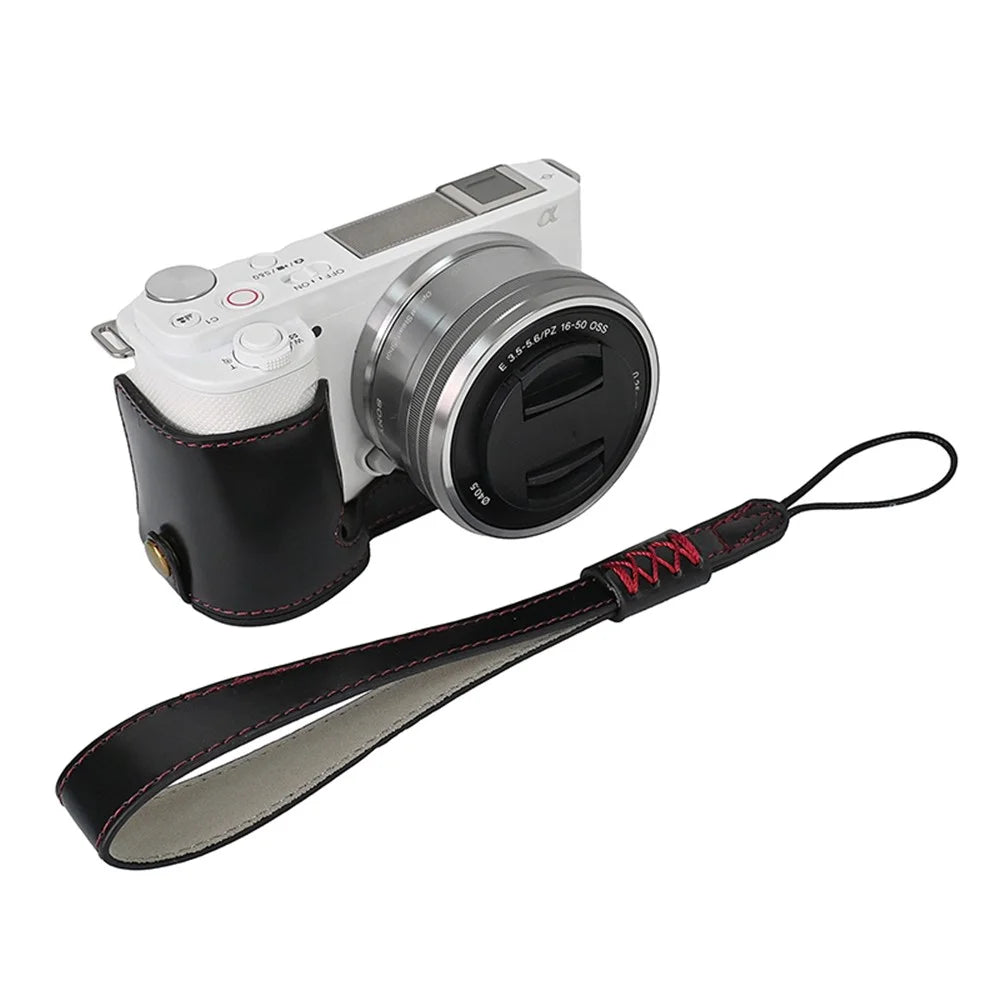 For Sony ZV-E10 Battery Opening Design PU Leather Camera Cover Half Body Bottom Case with Wrist Strap - Black - 1